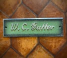 W.C. gutter vegghengt skole/ toalett/ dørskilt i stål/ metall med grønn og sort patinert front thumbnail